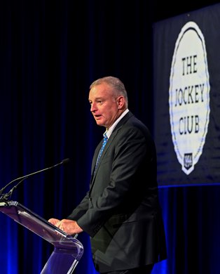 Tom Rooney, President and CEO of the NTRA  speaks during the Seventieth Annual Round Table Conference on Matters Pertaining to Racing at the Saratoga City Center Sunday Aug. 14, 2022 in Saratoga Springs N.Y. Photo  Credit:  The Jockey Club