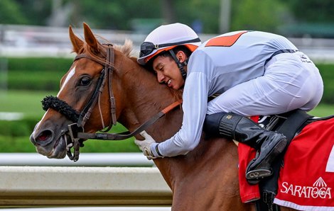 Jockey Jose Gomez shows his appreciation and jubilation to his horse Golden Rocket after winning the 20th running of The New York Stallion Series “Statue of Liberty Division at the Saratoga Race Course Wednesday Aug, 17 2022 in Saratoga Springs N.Y.