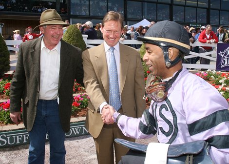 Richard Fields, majority owner of Suffolk Downs, at the track in Massachusetts during the 2007 season. Jockey Winston Thompson and Trainer Karl Grusmark