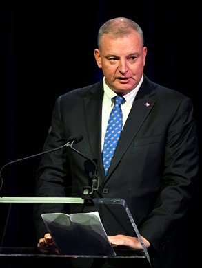 Tom Rooney, President and CEO of the NTRA  speaks during the Seventieth Annual Round Table Conference on Matters Pertaining to Racing at the Saratoga City Center Sunday Aug. 14, 2022 in Saratoga Springs N.Y. Photo  Credit:  The Jockey Club