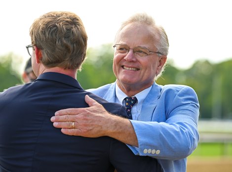 (LR): Riley Mott hugs Bill Mott after Cody's Wish and Junior Alvarado win the Forego Stakes (G1) at Saratoga Racecourse in Saratoga Springs, NY, on August 27, 2022.