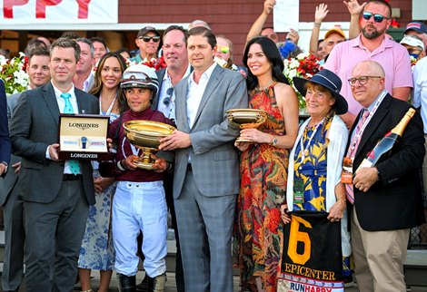 Ron Winchell, David Fiske and winning connections in the winners circle after Epicenter with Joel Rosario win the Runhappy Travers Stakes (G1) at Saratoga Race Course in Saratoga Springs, N.Y., on Aug. 27, 2022.