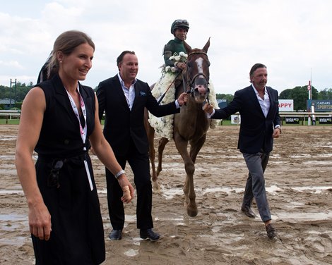 Walkin with members of Casteleton Lyon and Shane Ryan (on right). Chi Town Lady with Joel Rosario wins the Test Stakes (G1)<br><br />
Racing at Saratoga Race Course  in Saratoga Springs, N.Y., on Aug. 6, 2022.