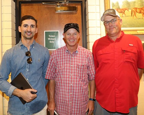 (LR): coach Michael Costa with Jebel Ali Stables, Jay Kilgore with Metrics Equine and Scott Kintz.  2557 hip pony by Dialed In out of Castle Road at Hinkle Farms Scenes at Keeneland September Sale on September 20, 2022.