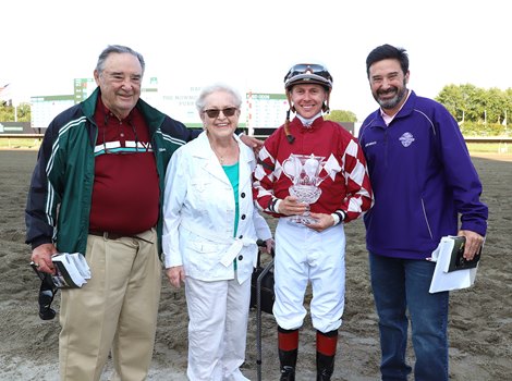 Jockey Dylan Davis joins the owners of Webslinger, the D.J. Stable (L to R) Leonard, Lois & son Jonathan Green in the winners circle trophy presentation after guiding Webslinger to victory in $500,000 Nownownow Stakes at Monmouth Park Racetrack in Oceanport, NJ on Saturday September 17,2022.  Photo By Bill Denver/EQUI-PHOTO