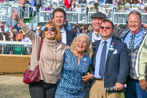 (L-R) Sarah Crocker, Martha Jane Mulholland, John Mulholland (foreground)<br>Manny Wah with Corey Lanerie wins the Stoll Keenon Ogden Phoenix (G2) at Keeneland, Lexington, Kentucky on October 7, 2022.