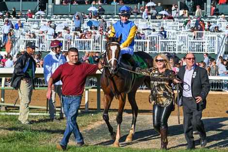 On right, owner Susan Moulton and trainer Wayne Catalano.<br><br />
Andthewinneris with Flavien Prat wins The Castle &amp; Key Bourbon (G2) at Keeneland, Lexington, Kentucky on October 9, 2022