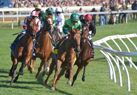 October 8, 2022:  Eventual winner In Italian (green cap) and jockey Joel Rosario,  lead the field around the clubhouse turn in the Gr.1 first Lady Stakes