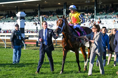 (L-R) Perry Bass and Ramona Bass lead in Annapolis with Irad Ortiz, Jr. after winning Coolmore Turf Mile (G1) at Keeneland, Lexington, Kentucky on October 8, 2022