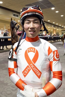 Kazushi Kimura wears orange silk jersey by TEC Racing to spread awareness about complex regional pain syndrome (CRPS)