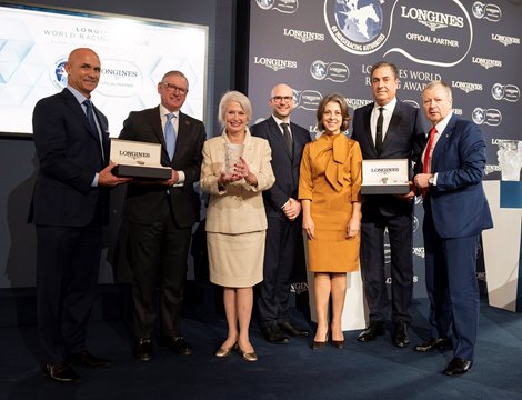 Mr. Winfried Engelbrecht-Bresges presents the 2022 LONGINES World's Best Racehorse Award to Flightline's connections in London, UK.  (From left: Terry Finley, Bill Farish, Jane Lyon, Matthieu Baumgartner, Stephanie Hronis, John Sadler, Winfried Engelbrecht-Bresges)