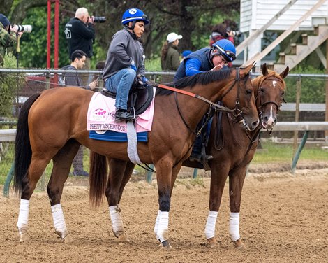 Trainer Brendan Walsh on pony gives Pretty Mischievous a pat after her work<br><br />
Horses training at Churchill Downs in Louisville, Ky., on April 29, 2023.