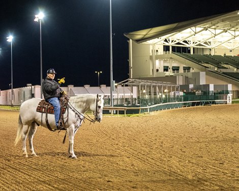 trainer D. Wayne Lukas talking to the outrider (not shown) at Churchill Downs in Louisville, Ky., on April 30, 2023
