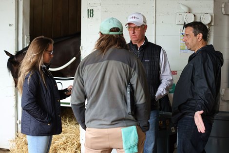 Mike Repole, owner of 2023 Kentucky Derby favorite Forte, right, discusses the availability of his horse for Saturday night’s race outside Forte’s barn at Churchill Downs in Louisville on Saturday morning, May 6, 2023 with trainer Todd Pletcher and Dr. Nicholas Smith, the chief veterinarian of the Kentucky Horse Racing Commission (back to camera).