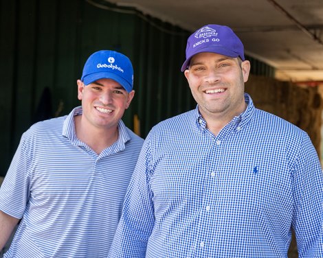 (L-R): assistant Trace Messina and trainer Brad Cox Horses training at Pimlico Racecourse in Baltimore, Md., on May 17, 2023.