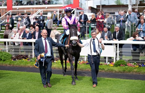 Azure Blue (Paul Mulrennan) are led into the winners enclosure after the Duke Of York Stakes<br><br />
York 17.5.23 Pic: Edward Whitaker