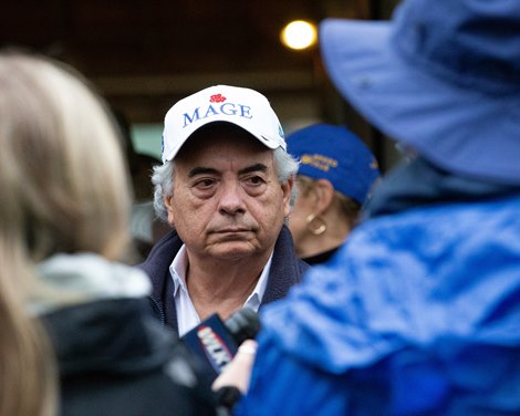 Trainer Gustavo Delgado talking to media.
