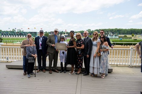 Winning connections include (L-R): Mr/Mrs. Anthony Manganaro, Hanley, Elliott Walden, Ortiz, Joi Garner, M/M Todd Pletcher. Emmanuel with Irad Ortiz wins the Poker (G3T)  at Belmont Park in Elmont, N.Y. on June 10, 2023