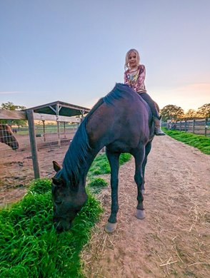 Magical Touch, formerly a racehorse for Nancy Messineo, is owned by Destiny Avilla in Grass Valley, Calif. The mare is shown here with Avilla&#39;s 6-year-old daughter River.