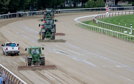 The NYRA track crew seals the dirt course at the Saratoga Race Course to protect the surface from heavy rains that pelted the track Sunday July 16, 2023 in Saratoga Springs, N.Y. Photo  by Skip Dickstein