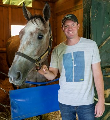 Local native Kinnon LaRose holds Hoosier Filly during his job of assistant to trainer Tom Amoss at the Saratoga Race Course Wednesday July 26, 2023 in Saratoga Springs, N.Y. Photo  by Skip Dickstein