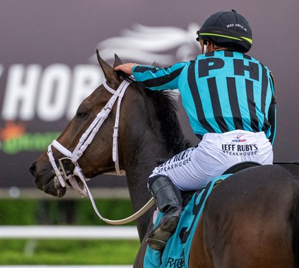 Jockey Irad Ortiz Jr. gives Uncashed a pat on the head after they won The Quick Call presented by The Thoroughbred Retirement Foundation at the Saratoga Race Course Sunday July 16, 2023 in Saratoga Springs, N.Y. Photo by Skip Dickstein