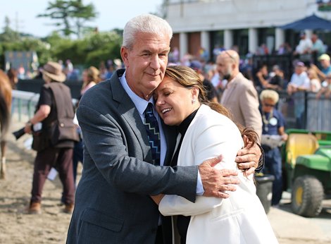 Trainer Cherie DeVaux gets a hug from Trainer Dan Ward after Shotgun Hottie #8 with Paco Lopez riding won the $500,000 G3 Molly Pitcher Stakes at Monmouth Park Racetrack in Oceanport, NJ. 7/22/23.  Photo By Bill Denver/EQUI-PHOTO