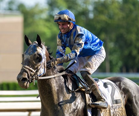 Jockey Flavien Prat gives Wet Paint a pat on the neck after winning the 107th running of The Coaching club American Oaks at the Saratoga Race Course Saturday July 22, 2023 in Saratoga Springs, N.Y. Photoby Skip Dickstein