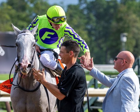 Jockey Luan Machado aboard Next gets a handshake from trainer Willian D. Cowans after winning the 13th running of The Birdstone at the Saratoga Race Course Thursday July 27, 2023 in Saratoga Springs, N.Y. Photo  by Skip Dickstein