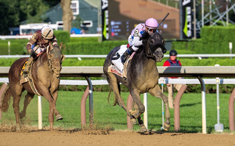 Arcangelo with jockey Javier Castellano,center with pink helmut starts to pull ahead to win the 154th running of The Travers Stakes the Saratoga Race Course Saturday Aug 26, 2023 in Saratoga Springs, N.Y. Photo Special to the Times Union by Skip Dickstein