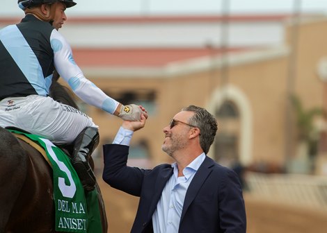 Aron Wellman of Eclipse Thoroughbred Partners, right, celebrates with jockey Umberto Rispoli, left, after Anisette&#39;s victory in the Grade I, $300,000 Del Mar Oaks, Saturday, August 19, 2023 at Del Mar Thoroughbred Club, Del Mar CA.<br>
&#169; BENOIT PHOTO
