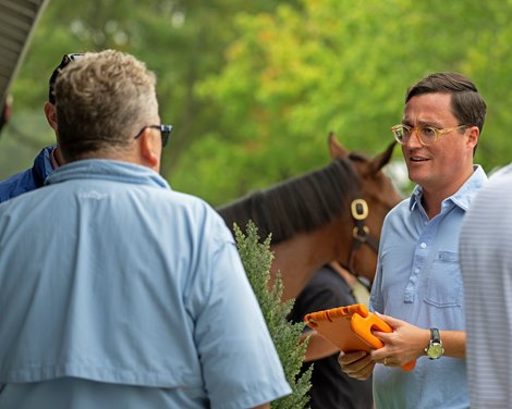 Dean Roethemeier, assistant sales director at Keeneland, on right, talks with Keeneland sales associate Kyle Wilson (hidden) and Stuart Angus with Taylor Made (back to camera). <br>
Keeneland sales scenes on Sept. 9, 2023.
