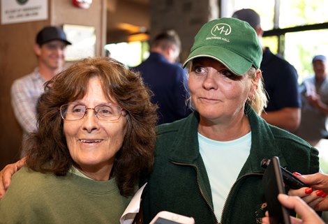 (L-R): Sandy Willwerth and Carrie Brogden with Hip 331 a yearling colt by Into Mischief out of Special Me, that was consigned by Machmer Hall Sales to the 2023 Keeneland September Yearling Sale on Sept. 12, 2023 at Keeneland in Lexington, KY.