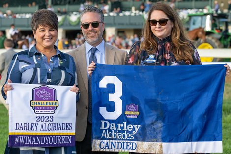 Candied with Luis Saez wins the Darley Alcibiades (G1). (L-R): Dora Delgado, Aron Wellman, Kelsey Marshall Hughes <br>
Keeneland racing on Oct. 6, 2023.