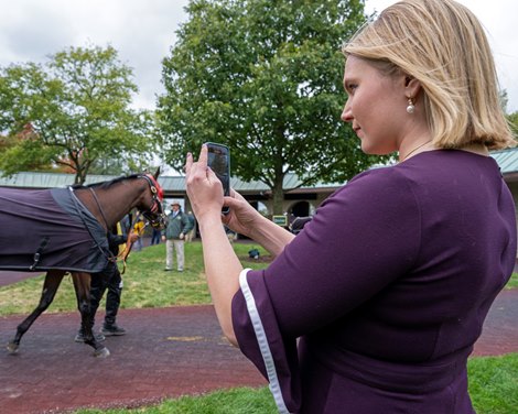 Hayley Amoss in the Keeneland saddling area doing social media on Oct. 14, 2023.