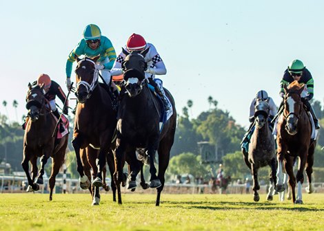 Dan Eplin&#39;s Dreamfyre and jockey Hector I. Berrios, red cap, win the battle in the stretch with Buttercream Babe and Ramon Vazquez (yellow/turquoise cap), to win the Grade III $200,000 Surfer Girl Stakes Sunday, October 8, 2023 at Santa Anita Park, Arcadia, CA.