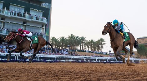 Forever Young (Ryusei Sakai,left) beats Book&#39;em Danno (Irad Ortiz jr) to win the Saudi Derby<br><br />
King Abdulaziz racecourse, Riyadh 24.2.24<br><br />
Pic: Edward Whitaker