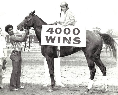 Walter Blum is pictured in the winner's circle at Monmouth Park astride Student Lamp after piloting the Thoroughbred to victory in the 7th race, July 27, 1973. The winner was the 4,000th in the career of jockey Blum