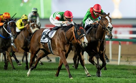 Facteur Cheval (Maxime Guyon, right) beats Namur in the Dubai Turf<br>
Dubai 30.3.24 Pic: Edward Whitaker