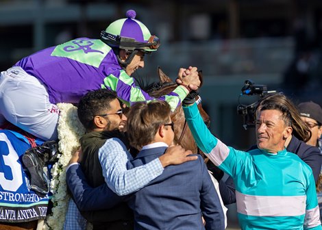Jockey Lanfranco Dettori, right, celebrates with winning jockey Antonio Fresu, left, after Stronghold&#39;s victory in the Grade I, $750,000 Santa Anita Derby, Saturday, April 6, 2024 at Santa Anita Park, Arcadia CA.<br><br />
&#169; BENOIT PHOTO