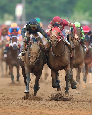 Sierra Leone (outside 2nd) and Forever Young (3rd) battle in the 2024 Kentucky Derby