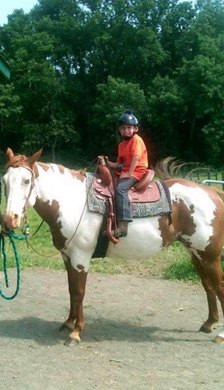 Young Christopher Elliott on the paint pony Vivid. (Courtesy Elliott family)