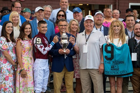 The connections gather around jockey Brian Hernandez Jr. after Thorpedo Anna  won the 94th running of The DK Horse Acorn Friday June 7, 2024 at the Saratoga Race Course in Saratoga Springs, N.Y.  Photo  by Skip Dickstein