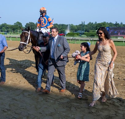 Jockey John Velazquez rides Fierceness as owner Mike Repole, center with daughter Gioia and wife Maria lead him to the winner’s circle after winning the 61st running of these Jim Dandy presented by Mohegan Sun -Grade II at the Saratoga Race Course Saturday July, 27, 2024 in Saratoga Springs, N.Y.  Photo  by Skip Dickstein