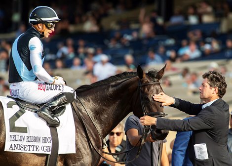 Eclipse Thoroughbred Partners' Anisette and jockey Umberto Rispoli are greeted by winning trainer Leonard Powell, right, after victory in the Grade II $200,000 Yellow Ribbon Handicap Saturday, August 10, 2024 at Del Mar Thoroughbred Club, Del Mar, CA.  <br>
Benoit Photo