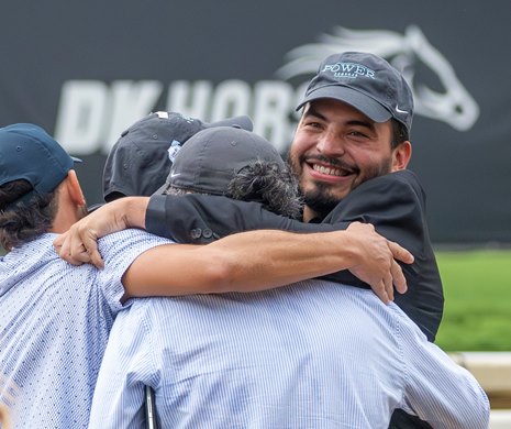 Trainer Jorge Delgado, right is jubilant and hugs his staff after Power Squeeze with jockey Javier Castellano noses out Candied ridden by Manuel Franco to win the 144th running of The Alabama presented by Keeneland Sales at the Saratoga Race Course Saturday Aug 17, 2024 in Saratoga Springs, N.Y.  Photo by Skip Dickstein