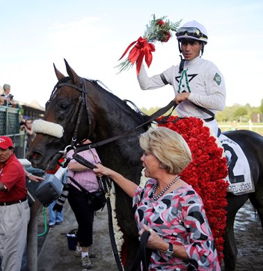 PHOTO BY SKIP DICKSTEIN - Colonel John with jockey Garrett Gomez is lead to the winner's circle by owner Susan Casner after outdueling Mambo in Seatle ridden by Robby Albarado to the wire in the 139th running of The Travers Stakes at the Saratoga Race Course in Saratoga Springs, New York August 23, 2008. SARATOGA RACING