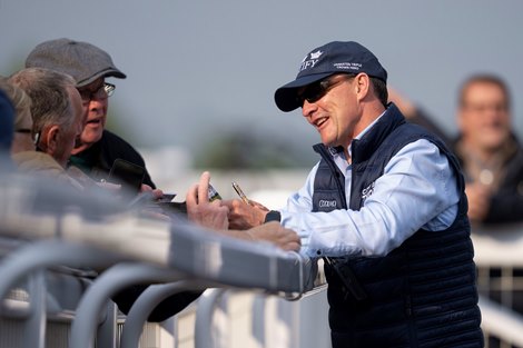 Aidan O'Brien signs autographs after City of Troy's gallop Southwell 20.9.24 Pic: Edward Whitaker