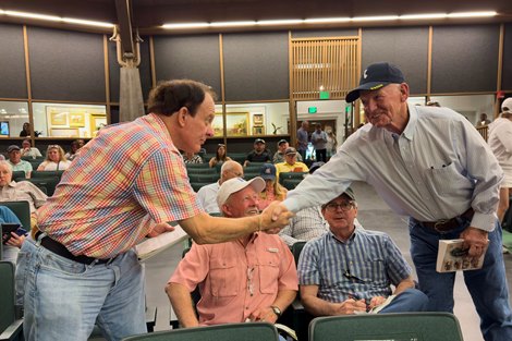 Hip 695 Doug Scharbauer is congratulated by Steve Jackson while Donny Denton and Ken Carson look on,, 2024 Keeneland September Sale