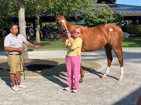 Mandy Pope with Hip 347, a colt by Curlin out of the great race mare Cavorting at the Keeneland September Yearling Sale.